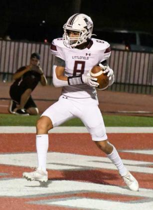 TWO-POINT CONVERSION – Littlefield junior tight end, Jeremiah Trevino (8), catches a two-point conversion pass from quarterback Chip Green to extend the lead for the Wildcats in the second half of the Wildcats’, 33-14, victory over Denver City on the road on Friday night. (Staff Photo by Derek Lopez)