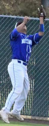 MAKING A PLAY- Olton right fielder, Jacob Marquez, catches a fly ball for an out, during the Mustang’s seeding game against New Deal on Monday in Littlefield. (Staff Photo by Derek Lopez)