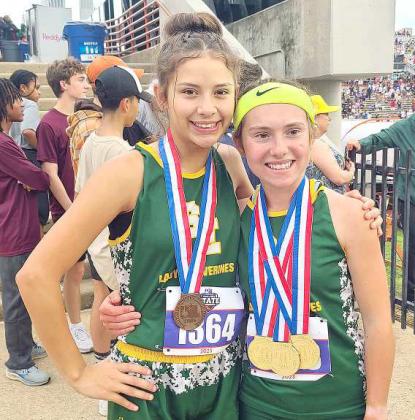 BRINGING HOME THE HARDWARE - Springlake-Earth juniors, Taytum Goodman and Emma Samaron finished fourth as a team overall with 36 points at the UIL 1A State Track Meet in Austin, Tx, this past weekend. Goodman brought home three gold medals and three state records in the women’s 3,200-meter run, women’s 800-meter run and the women’s 1,600-meter run, while Samaron placed third in the women’s 300-meter hurdles. See results in Wednesday’s edition of the Leader-News. (Submitted Photo)