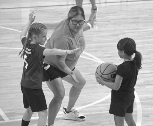 Instructor Lety Jimenez plays with campers during a scrimmage at the Olton Fillie Basketball Camp on June 2 at Olton Gymnasium. (Photo by Leon Szaniszlo)