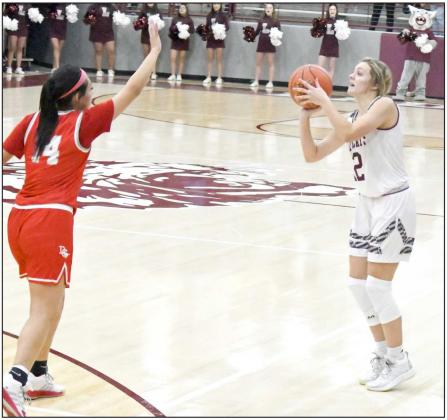 LETTING IT FLY— Littlefield sophomore, Madison McNeese (12), lets a three fly from the left elbow, during the first half of the Lady Cats district victory over Denver City on Tuesday in their first meeting of the season with the Fillies. (Staff Photo by Derek Lopez)