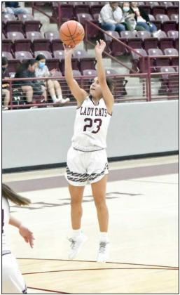 PULLING UP —Littlefield senior guard, Geyah Garza (23), pulls up for a free-throw line jumper, during the first half of the Lady Cats district victory over Denver City on Tuesday in their first meeting of the season with the Fillies. (Staff Photo by Derek Lopez)