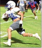 Olton running back Callen Burns, catches a pass and turns it up field for a Mustang touchdown, during their Midnight Madness scrimmage Friday night. (Staff Photo by Derek Lopez)