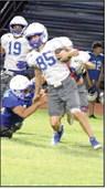 Olton receiver, Ezekiel Coronado, catches a pass and looks to break a tackle, during their Midnight Madness scrimmage Friday night. (Staff Photo by Derek Lopez)