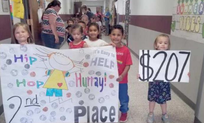 KINDERGARTEN STUDENTS WON SECOND PLACE in coin collection. They brought in $207 for the Coins for Kids Neuroblastoma Foundation Project at Littlefield Primary School. They celebrated in a parade around the hallways in the Primary Building. (Submitted Photo)