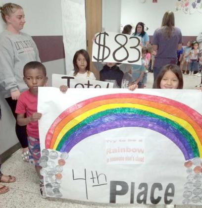 PRE-K STUDENTS - gathered $83 for the Coins for Kids contest and took fourth place in the contest. They celebrated in a parade around the halls of the Primary Building.