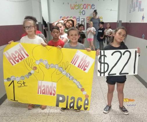 SECOND GRADE STUDENTS, Best Coin Collectors - They brought in $221 for the Coins for Kids’ Neuroblastoma Foundation Project at Littlefield Primary School. They celebrated in a parade around the hallways in the Primary Building.