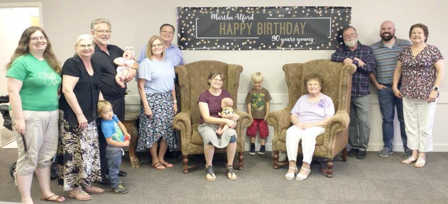 ALFORD FAMILY MEMBERS -- (Left to right) Jaclyn Alford, Jeanie Alford, Luke Gardner, Scott Alford (holding Charis Gardner), Suzanne Alford, Danny Alford, JennyBeth Gardner (holding Caleb Gardner), Nathanael Gardner, Martha Alford, Phil Alford, Andrew Alford, and Rhonda Alford. (Submitted Photo)
