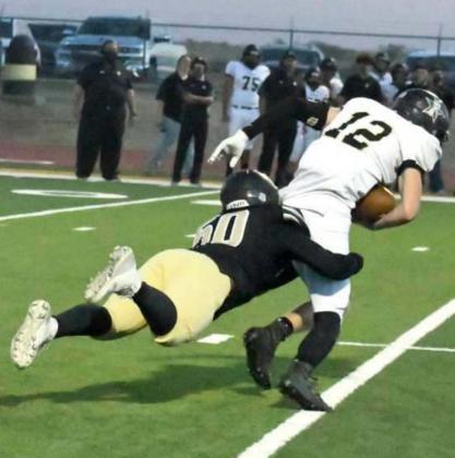 GETTING THE SACK – Sudan defensive lineman, Jeremiah Castillo, blocked a pass from Plains quarterback, Cole Reynolds, who caught his own pass, but Castillo was able to dive and wrap him up for the sack forcing a turnover on downs for the Hornet’s defense, during their Homecoming win on Friday over Plains. (Staff Photo by Derek Lopez)
