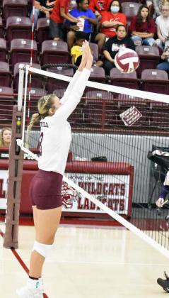 PUTTING UP A WALL – Littlefield sophomore, Madison McNeese, jumps up and deliveres a block for a kill, during the Lady Cats’ win over Dimmitt on Tuesday in straight sets. (Staff Photo by Derek Lopez)