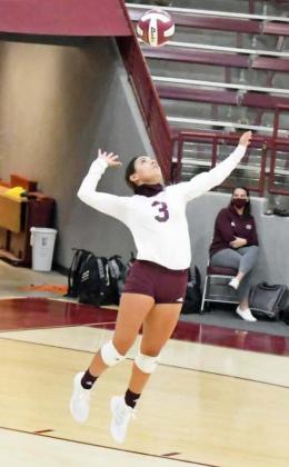 LOOKING FOR AN ACE – Littlefield senior captain, Geyah Garza, goes up to deliver the jump serve, looking for a point, during the second set of the Lady Cats’ win over Dimmitt on Tuesday in straight sets. (Staff Photo by Derek Lopez)