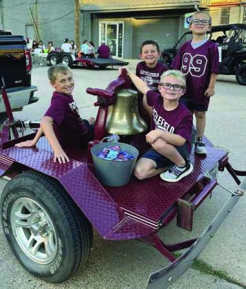 Graceson Golden, Brecken Nelson, Sawyer Nelson and Taos Duncan ride with the bell in the parade on Thursday. (Submitted Photo)