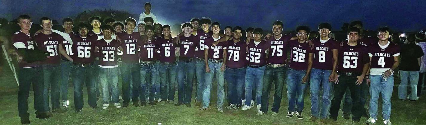 The Littlefield varsity football team gathers at the bonfire on the eve of their Homecoming game against Coahoma. (Staff Photo by Derek Lopez)