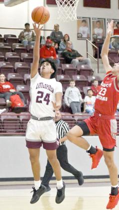 Littlefield freshman, Jayden Barrio (24), gets to the hoop and finishes with a lay-up off the glass, during the first half of the Wildcats’ blowout victory over the Mustangs at home on Tuesday. (Staff Photo by Derek Lopez)