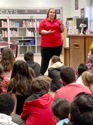 EMS 911 OPERATOR SPEAKS TO 4TH GRADERS—Kristen DeLoach, a former Littlefield student, and now an EMS 911 operator, advised Littlefield fourth grade students that her position is an essential job, because it helps callers get the help they need when in an emergency situation. She answered questions from the students, about her job. See story about her job and the answers she gave them. (Littlefield ISD Photo)