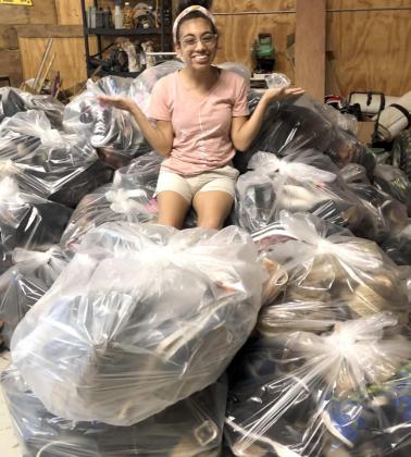 LOOK AT ALL THESE SHOES!—Ceci Schroeder, a senior a Amherst High School is raising funds to cover the cost of training her “Service Dog”, which will help her in many ways, such as helping her keep her balance, and make a special noise to alert for help if she needs it. (Submitted Photo)