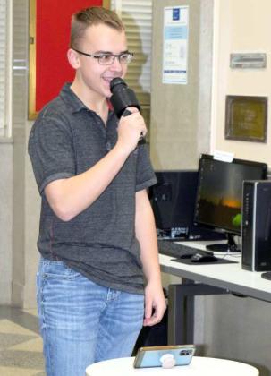 PEYTON WRIGHT sings the first song at the Teen Night New Years Karaoke hosted by the Lamb County Library on the last Thursday of the year 2022. (Photo by Ann Reagan)
