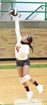 SENDING THE SERVE – Littlefield Lady Cats’ Libero, Emily Champion, leaps up to send the serve over the net, during their match on the road with Idalou last Tuesday. The Lady Cats fell to Idalou on the road in straight sets, 0-3. (Staff Photo by Derek Lopez)