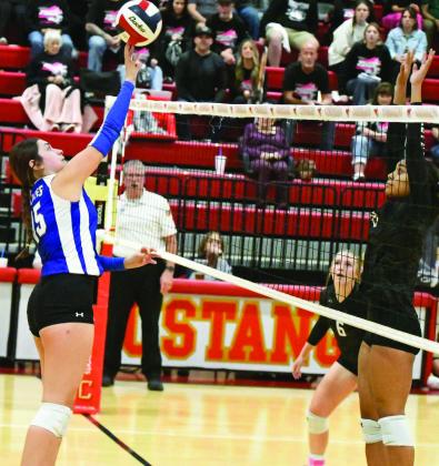 Olton’s Llama Ramirez drops a tip over Forsan’s Ary’Anna Mealing, looking for a kill, during the Fillies’ Area Play-off match against the Lady Buffaloes on Tuesday at Coronado High School. (Staff Photo by Derek Lopez)