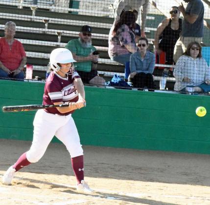 Littlefield’s Bri Aleman drives a pitch over third base for an RBI-single in the top of the first inning of the Lady Cat’s road district match-up with Idalou. The Lady Cats ended up taking the contest, 20-1, in five innings to improve to 2-1 in district play. (Staff Photo by Derek Lopez)