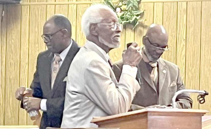 Pastor McCarty talks to the community about his favorite old songs and hymns. Shown are Pastor McCarty, Pastor Morgan and Pastor Coleman. (Submitted Photo)