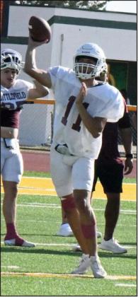 Littlefield quarterback, Nate Castaneda, drops back and fires a pass to his right, during the Wildcat’s scrimmage last Thursday with the New Deal Lions. (Staff Photo by Derek Lopez)