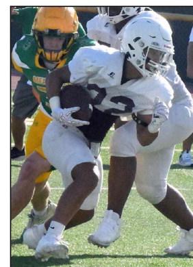 Littlefield running back, Blayton Soliz, took a run up the middle, during the Wildcats’ scrimmage last Thursday with the New Deal Lions. (Staff Photo by Derek Lopez)