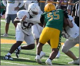 Littlefield offensive linemen, CJ Weaver and Tate Clark double team a New Deal defensive lineman, during the Wildcat’s scrimmage last Thursday with the Lions. (Staff Photo by Derek Lopez)