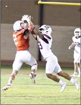 FORCING AN INCOMPLETE - Littlefield’s Diego Ramirez (33), breaks up a catch against Brownfield’s Gage McPherson, during the Wildcats road victory last Friday to close out the pre-district schedule. (Staff Photo by Derek Lopez)