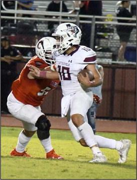 IN FOR SIX - Littlefield junior tailback, Ian Mendez, takes the handoff from Chip Green and looks for a running lane up the middle, during the second half of the Wildcats road victory last Friday to close out the pre-district schedule. (Staff Photo by Derek Lopez)