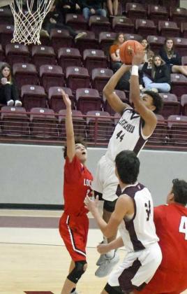 FINISHING AT THE RIM – Littlefield junior, Tyrell Norman (44), takes the ball strong to the hoop for a lay-up, off of the assist from Jordan Trevino, during the Wildcats victory over Lockney Monday night in the first round of the Wildcat Classic. (Staff Photo by Derek Lopez)