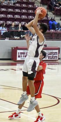 PULLING UP – Littlefield senior, Jaron Cabello (30), pulls up for a jumper from the left elbow, during the first half of the Wildcats’ victory over Lockney Monday night in the first round of the Wildcat Classic. (Staff Photo by Derek Lopez)