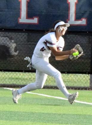 Littlefield senior, Myli Hernandez, catches a fly ball on the rightfield line for the third out in the top of the first inning of the Lady Cats’ 10-1, loss to the Bushland Lady Falcons in Plainview on Thursday in their Class 3A-DI Bi-district play-off game. (Staff Photo by Derek Lopez)