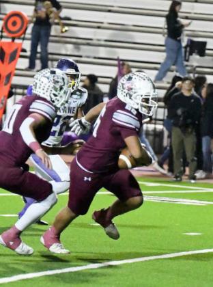 Littlefield sophomore nose guard, JJ Gonzales, picks off Crane quarterback, Tyson Brents, and returns it to the two-yard line, to set up first and goal for the Wildcat offense, during the second quarter of the Wildcats’ 3A Area Championship win over Crane in Lamesa on Friday. (Staff Photo by Derek Lopez)