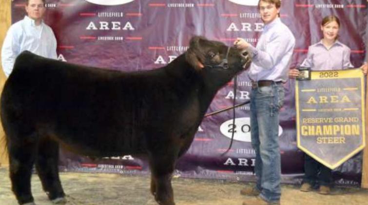 RESERVE GRAND CHAMPION STEER was exhibited by Drew Carr of Sudan 4-H. The Show Judge, Zachary Wagoner is also shown.