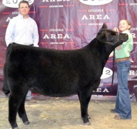 RESERVE GRAND CHAMPION BEEF HEIFER was exhibited by Piper Carr. The Show judge, Zachary Wagoner of Pearland is shown with them. (Staff Photo by Joella Lovvorn)