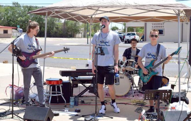 ”Clock Struck 9' band performed for the 50th Anniversary Celebration of Wrights Collision Center in Littlefield on Saturday, July 22, 2023. Band members left to right: Tyler Blackburn- Bass, Sergio Perez- Drums, Ryan Runquist- keyboard and vocals, and Peyton Wright- guitar. (Photo by Ann Reagan)