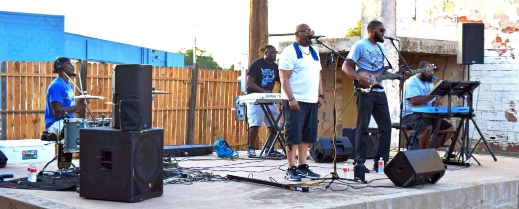 Touch of Soul,, featuring Isaac Hicks on keyboard, Brodrick Harris-Bass guitar, Manuel Gonzales-Lead vocalist, Eric Hightower-Keys, and Bally Harris -Drums' Kicked off the concert and street dance with soul favorites 'When a Dove Cries' by Prince, and 'Stand by Me' by Ben E. King. The group has performed together for eight years. (Photo by Ann Reagan)