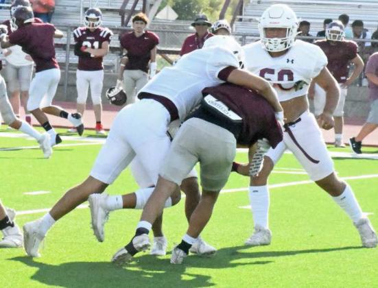 LAYING THE WOOD - Littlefield senior linebacker, Jeremiah Trevino, gets through the line of scrimmage and levels the Tulia ball carrier, during their scrimmage in Tulia last Thursday. (Staff Photo by Derek Lopez)
