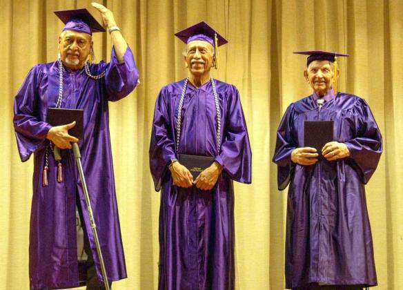 Carlos Boldivano, Rosendo Boldivano and Olan Johnson receive their high school diplomas in the Anton School auditorium on July 25, 2025. (Photo by Madison Vidales)
