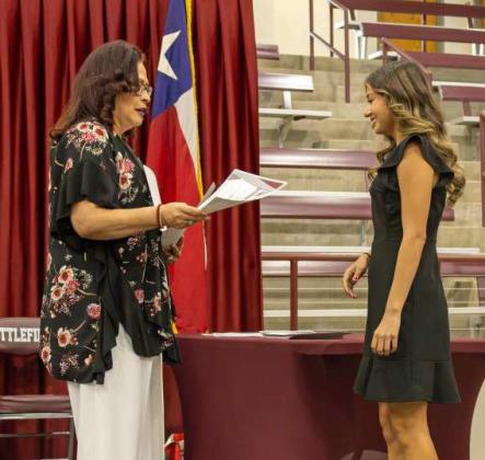 Brianna Martinez receives the $1,000 Early Risers Lions Club Scholarship at the Littlefield High School Scholarship Awards Ceremony on May 20, 2025. Martinez additionally received the $1,000 Food King Scholarship. (Staff Photo by Madison Vidales)