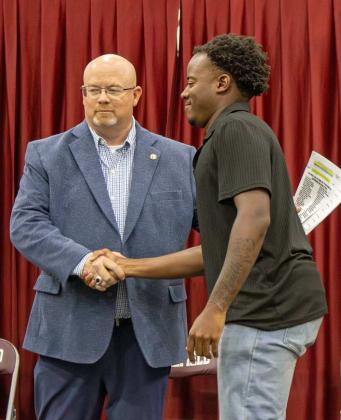 Eizeah Coleman receives the $500 Dunbar LHS Ex-Student Association Scholarship at the Littlefield High School Scholarship Awards Ceremony on May 20, 2025. (Staff Photo by Madison Vidales)