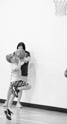 Campers work on lay-ups, during the Littlefield Basketball Camp that was held in June at the Elementary Gym. (Staff Photo by Derek Lopez)