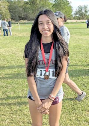 LEADING THE WAY - Littlefield’s Adrianna Castillo finished 11th overall in the girl’s junior high race to help the junior high Lady Cat’s team to a fourth place finish last weekend at the Oil Path Invitational in Sundown. (Submitted Photo)