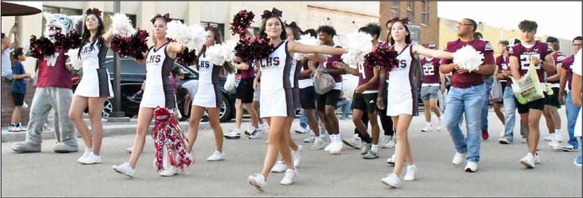 LITTLEFIELD HIGH SCHOOL VARSITY CHEERLEADERS AND FOOTBALL TEAM