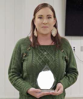 Lamb County Judge Mike DeLoach presented retiree Jennifer McKinnon with a plaque, during the Lamb County Thanksgiving Luncheon on Wednesday. (Staff Photo by Derek Lopez)