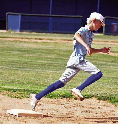 Campers during the afternoon session work on base running on Thursday at the Olton Youth Baseball Camp. (Staff Photo by Derek Lopez)
