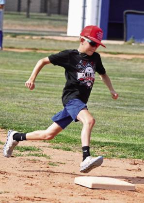 Campers during the afternoon session work on base running on Thursday at the Olton Youth Baseball Camp. (Staff Photo by Derek Lopez)