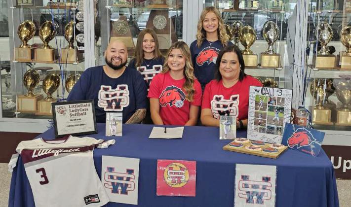 Littlefield's Cali Saldana signed on Thursday to continue her academic and softball career at The University of the Southwest in Hobbs, N.M. She signed during a small ceremony in front of the trophy case at Wildcat Gymnasium surrounded by family, friends, coaches and teammates. (Staff Photo by Derek Lopez)