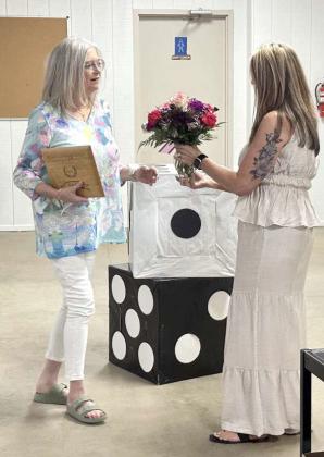 Rotary Club of Littlefield President-Elect Bree Clark presents the Administration Assistant of the Year award to Ann Ray on April 22, 2026. (Photo by Madison Vidales)